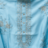 Man wearing sky blue embroidered kurta with white pants and tan sandals (2)