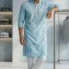 Man wearing sky blue embroidered kurta with white pants and tan sandals (2)
