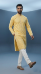 Men's bright yellow festive kurta featuring intricate mirror embroidery and mandarin collar, perfect for Haldi ceremony (1)