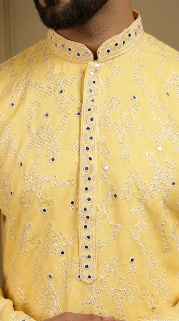 Men's bright yellow festive kurta featuring intricate mirror embroidery and mandarin collar, perfect for Haldi ceremony (1)