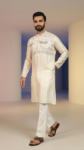Off-white silk men's kurta with detailed elephant embroidery, straight-cut pajama, and sandals (1)